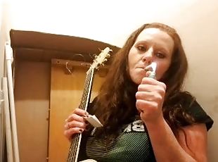 Getting ready to play my guitar while smoking