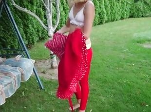 Cute blonde changing her dress