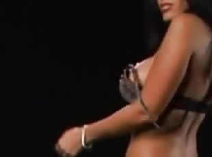 Sexy striptease from big tits brunette