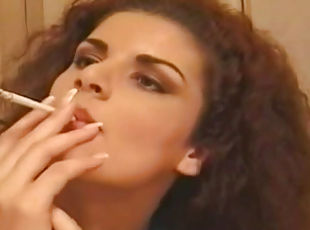 Sexy brunette smoking and undressing