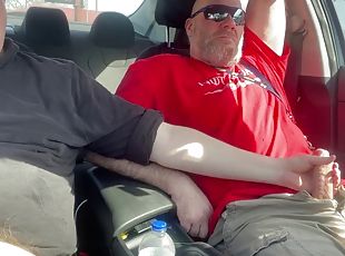 Stroking our dicks in the car in the parking lot