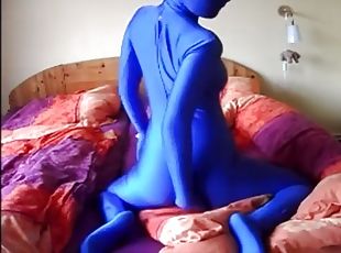 Beautiful woman masturbates in blue zentai