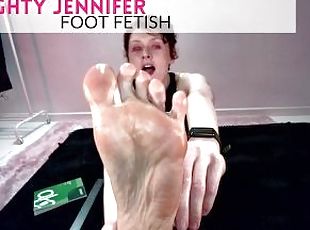 Naughty Jennifer rubs lotion on her feet