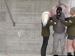 Military femdoms give BDSM ballbusting 3some outdoor