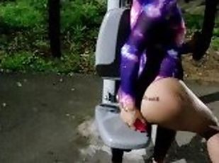 Sissy exercising (her asshole) in a public park's gym (with a dildo) then gets fucked right there