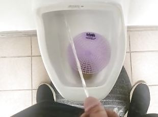 Pissing in a urinal