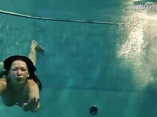 Underwater with bikini swimming girls