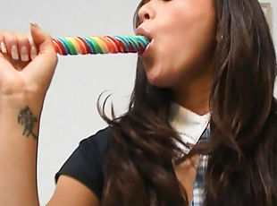 Curly brunette Natalia Forrest is sucking tasty candy