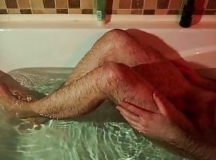 Man washes another guy's feet and ass in the bath, fingering, handjob. POV video