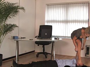 Trampling domina spanks her foot fetish sub in office