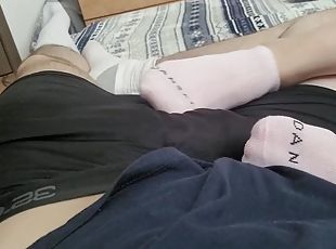 Footjob in socks leads to a huge cumshot on feet