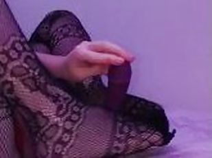 I give my dildo a footjob in sexy fishnet stockings