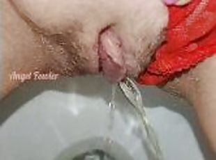 Delicious piss with red panties pushed aside in the toilet