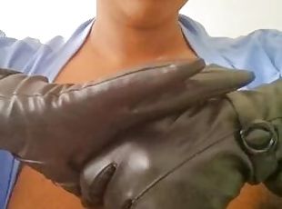 Ebony milf in black gloves and red lips sucks on a dildo imagining it to be a real dick