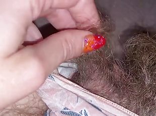 Closeup of huge clit head and hairy pussy